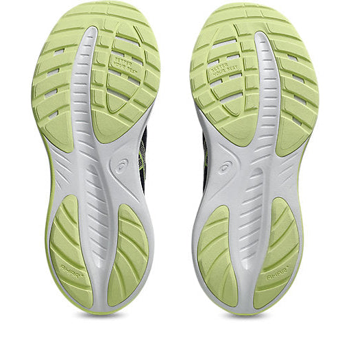 Close-up of green and white athletic shoe soles on a white background