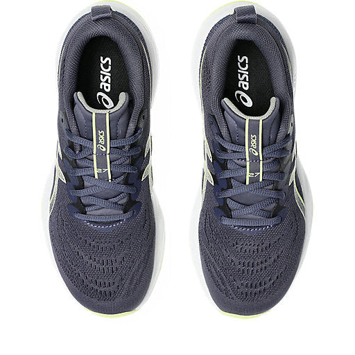 Pair of blue running shoes with white soles on a white background
