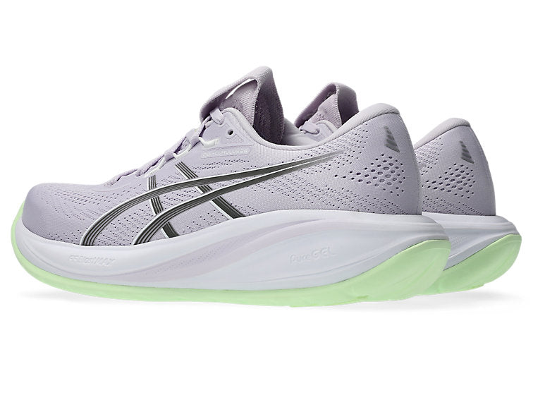 Gray running shoe with green sole on a white background