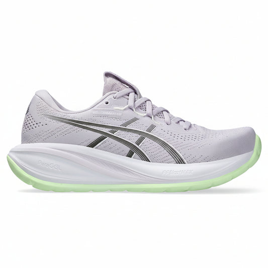 Light gray running shoe with green sole on a white background