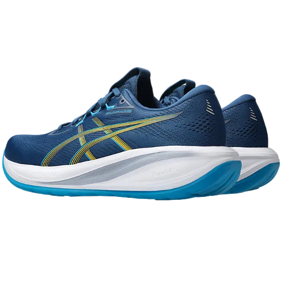 Blue running shoes with white sole on a white background
