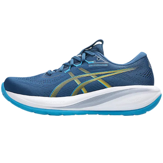Blue running shoe with white sole on a white background