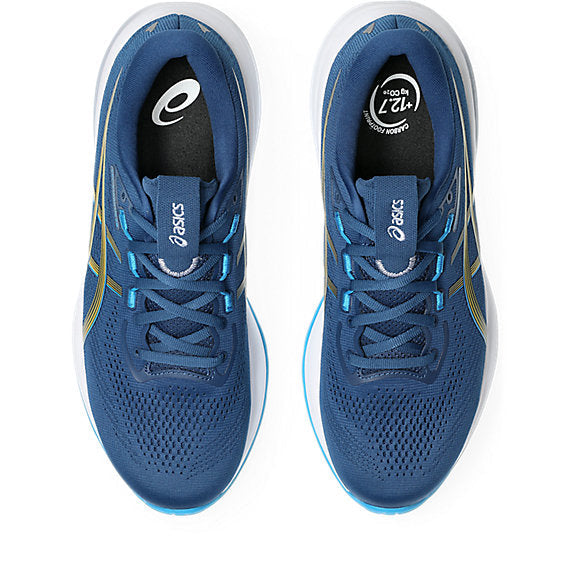 Blue running shoes with white soles on a white background