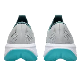 Gray running shoes with teal soles on a white background
