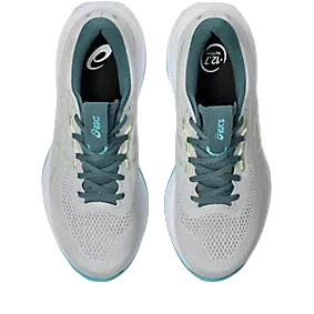 Pair of gray running shoes with blue laces on a white background