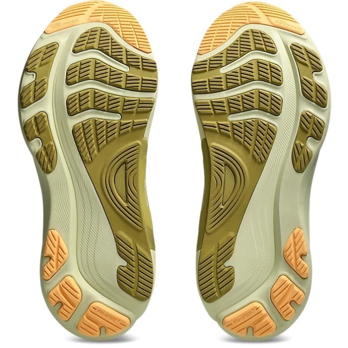Close-up of a pair of shoes with a detailed sole pattern on a white background