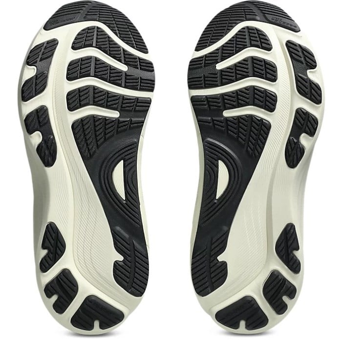 Close-up of black and white athletic shoe soles on a white background