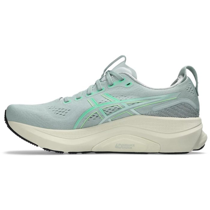 Light blue running shoe with green accents on a white background