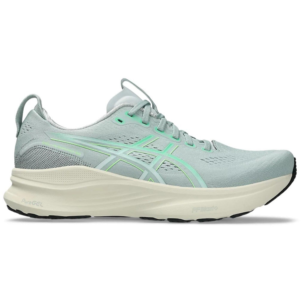 Light blue running shoe with green accents on a white background