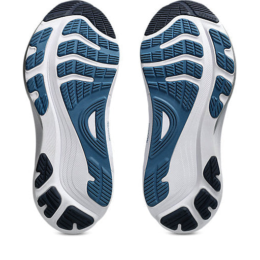 Close-up of a pair of running shoes with blue and white sole design on a white background