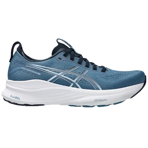Blue running shoe with white sole on a white background