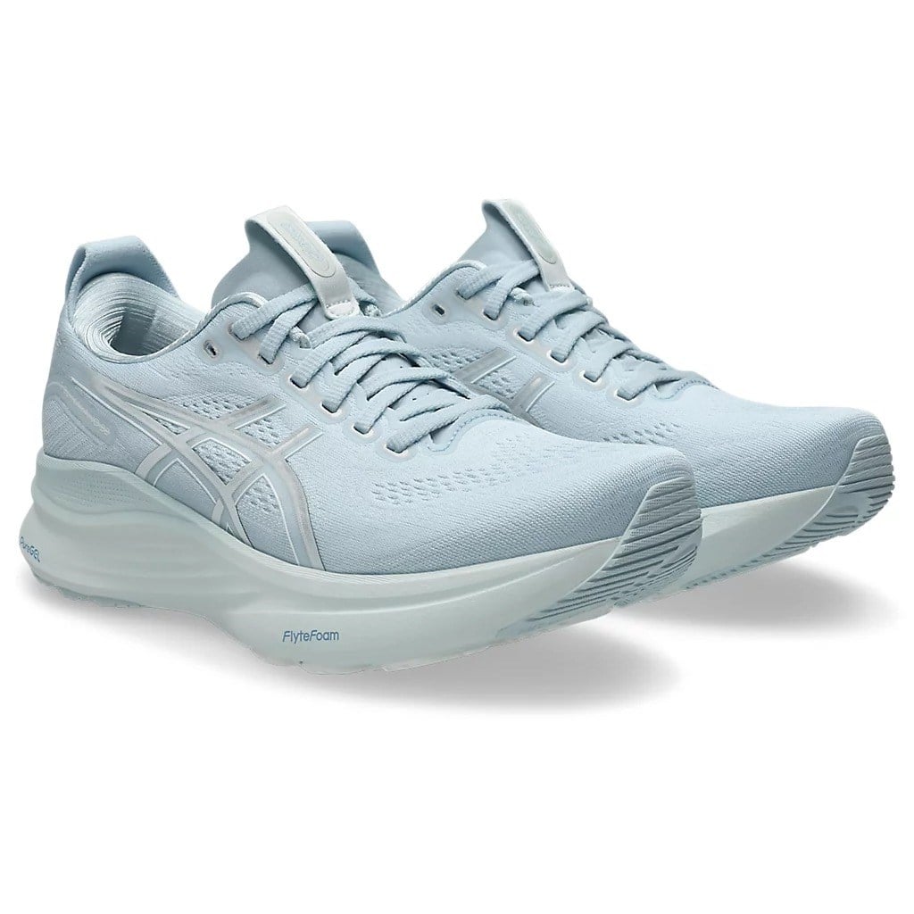 Light blue running shoes on a white background