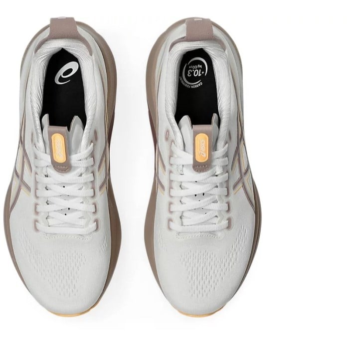 White running shoes with beige soles on a white background