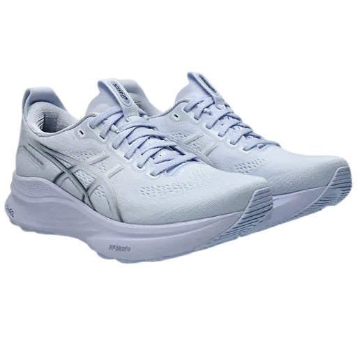 Light blue running shoes on a white background