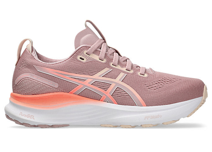 Pink running shoe with orange sole on a white background