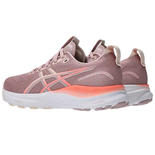 Pink running shoe with white sole on a white background