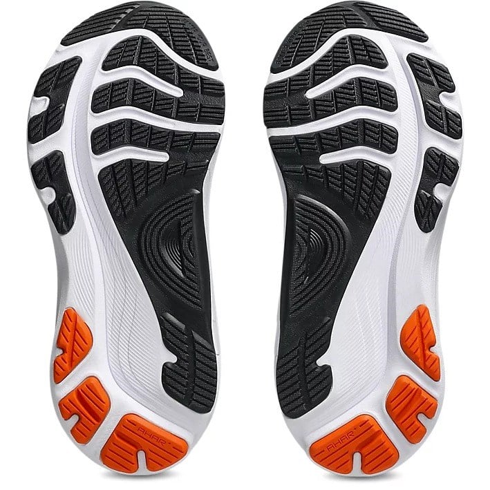 Close-up of the sole of a shoe with black, white, and orange design on a white background