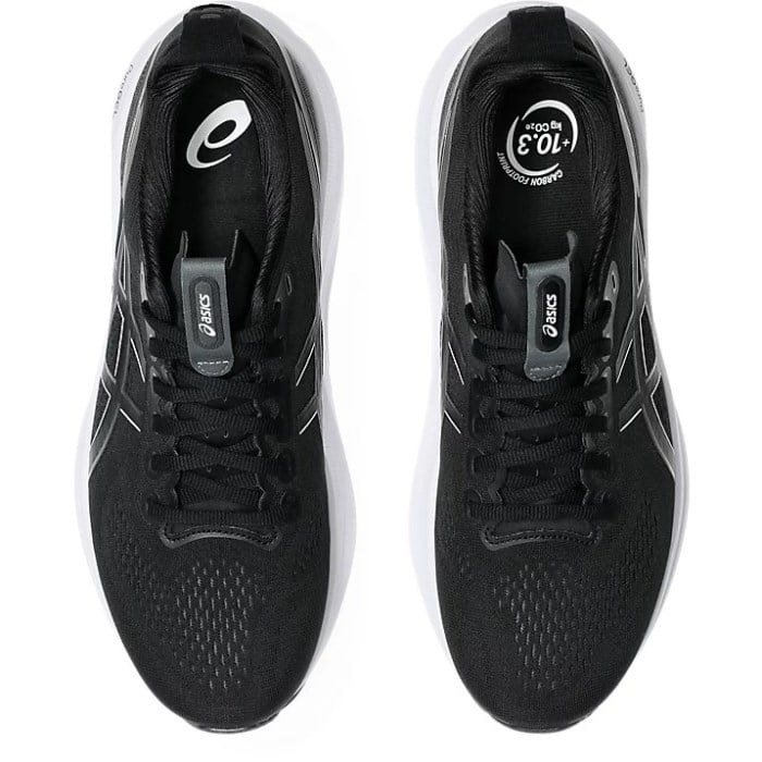 Black running shoes with white sole on a white background