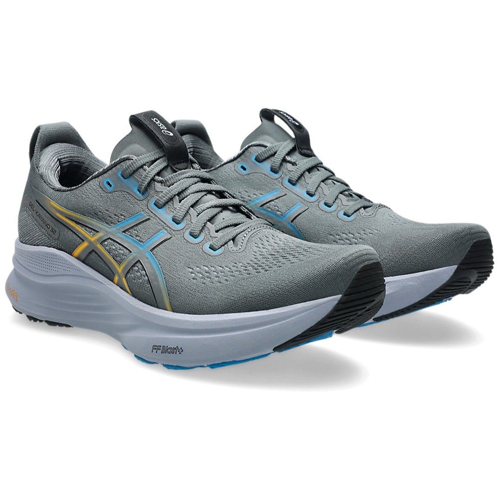 Gray running shoes with blue accents on a white background