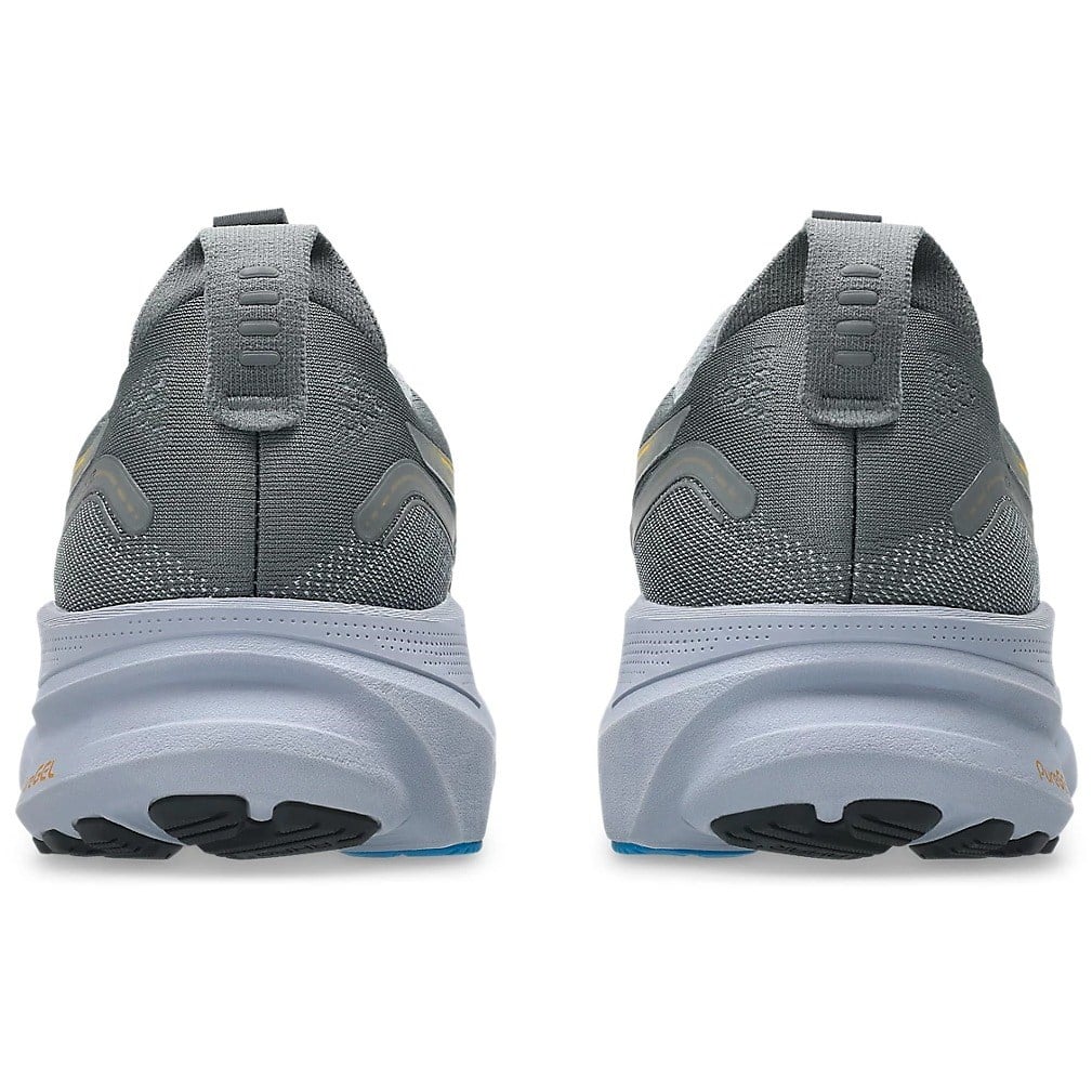 Gray running shoes shown from the back on a white background
