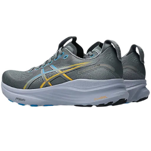 Gray running shoe with yellow accents on a white background