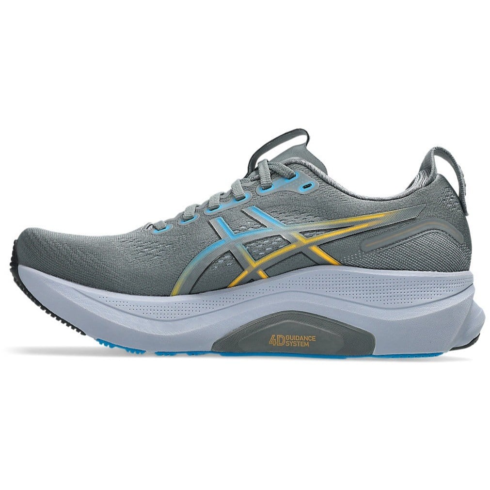 Gray running shoe with yellow accents on a white background