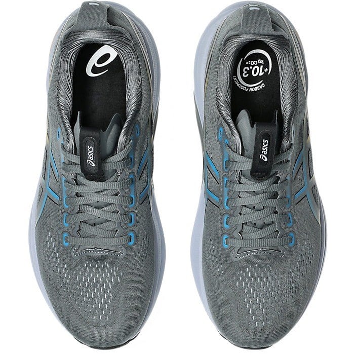 Pair of gray running shoes with blue accents on a white background