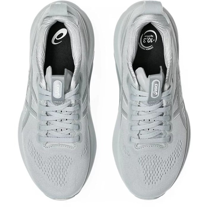 Pair of light gray running shoes with brand logo on a white background