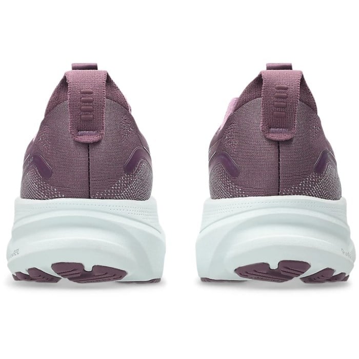 Purple athletic shoes with white soles on a white background