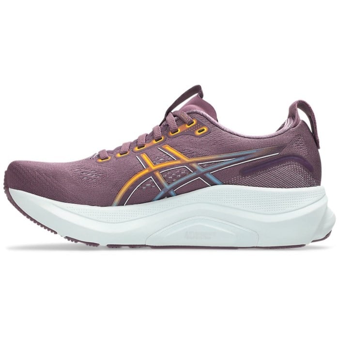 Purple running shoe with white sole on a white background