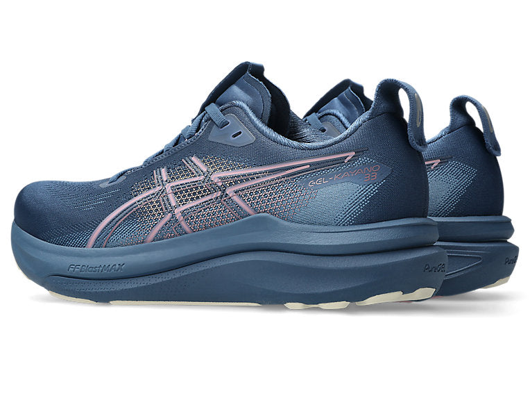 Blue running shoe with white sole on a white background