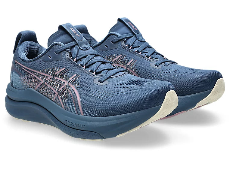 A pair of ASICS running shoes in navy blue with pink accents on the side stripes and tongue, shown against a plain white background.