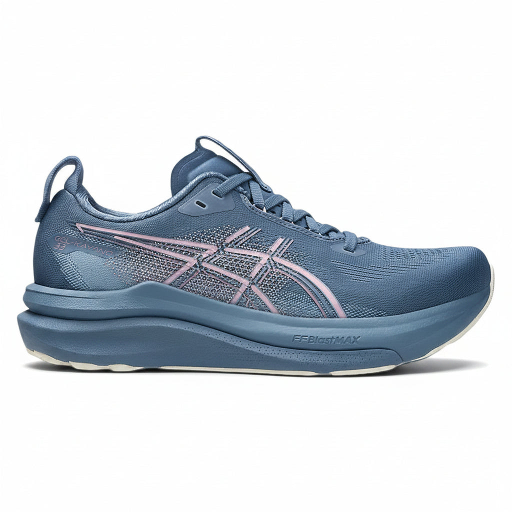 A blue ASICS running shoe with a textured mesh upper, pink and gray geometric side stripes, and a thick blue cushioned midsole, shown from a side profile on a white background.