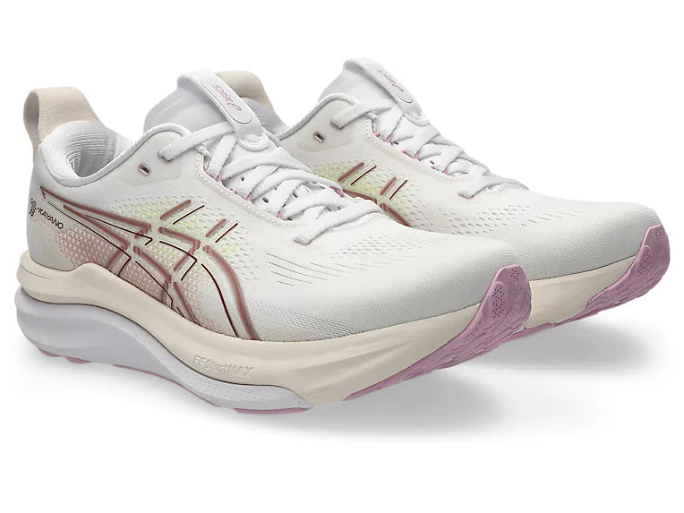 White and pink running shoes on a white background