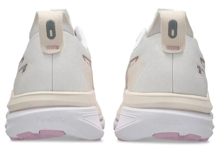 White sneakers with pink accents on a white background