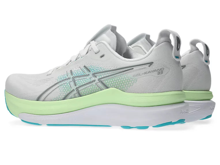 A pair of ASICS Kayano 33 running shoes in white and light gray with mint green and teal accents, shown from a side profile view on a white background.