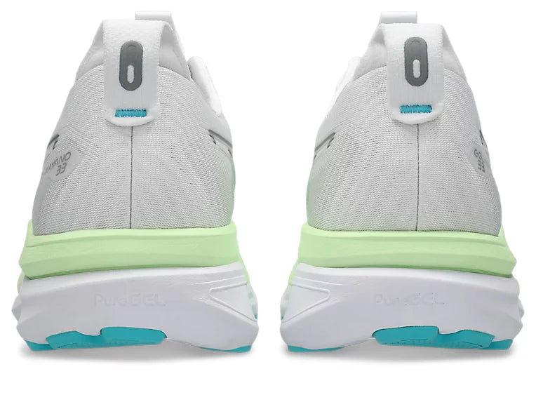 A pair of white running shoes shown from the back, featuring a white mesh upper, a thick white midsole with a bright lime green accent band, and teal outsole details.
