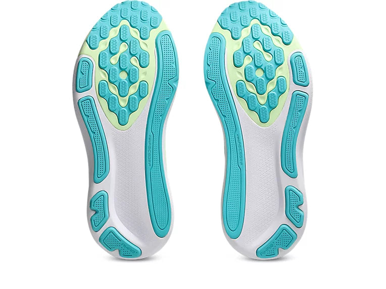 White shoe sole with blue and green textured pattern on a white background
