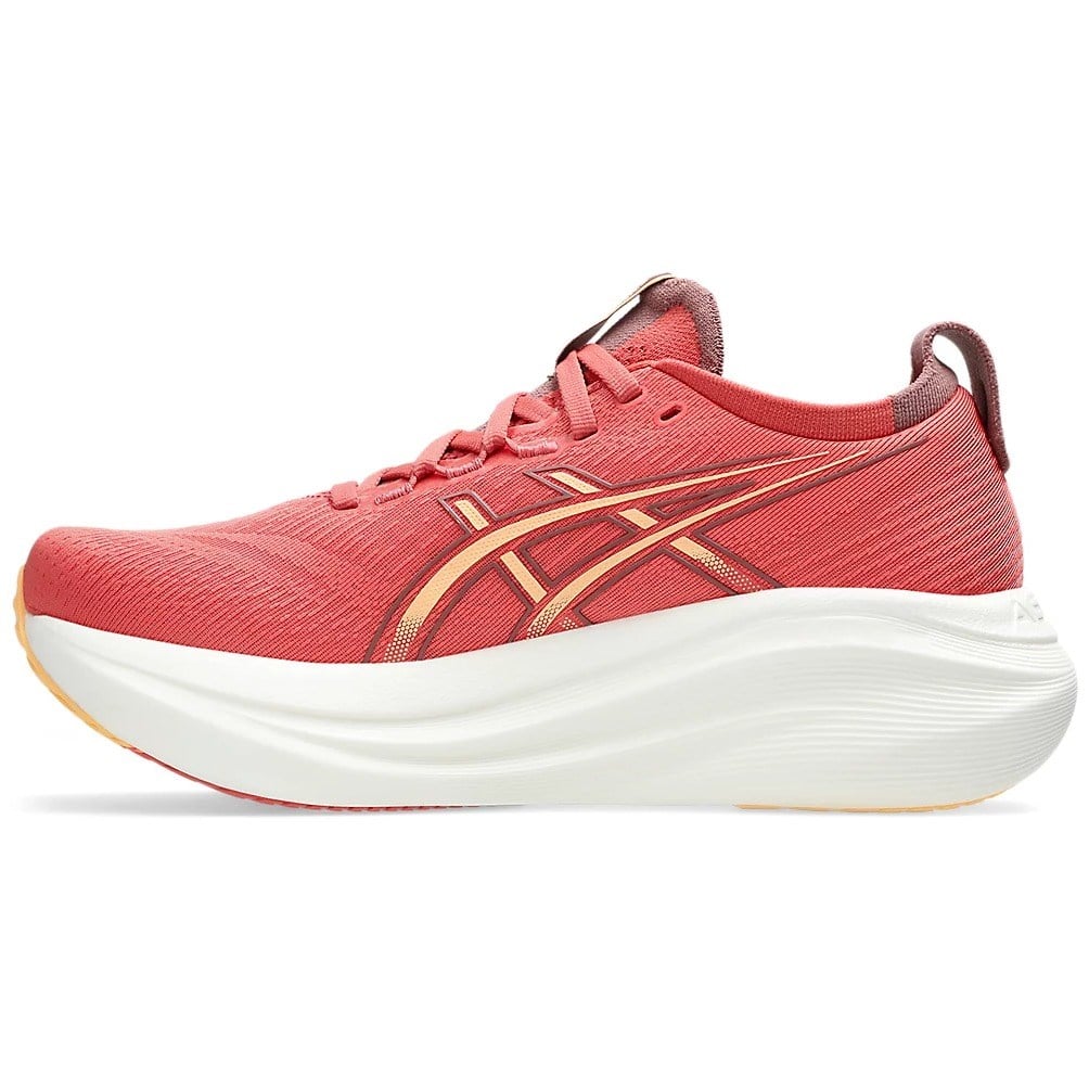 Red running shoe with white sole on a white background