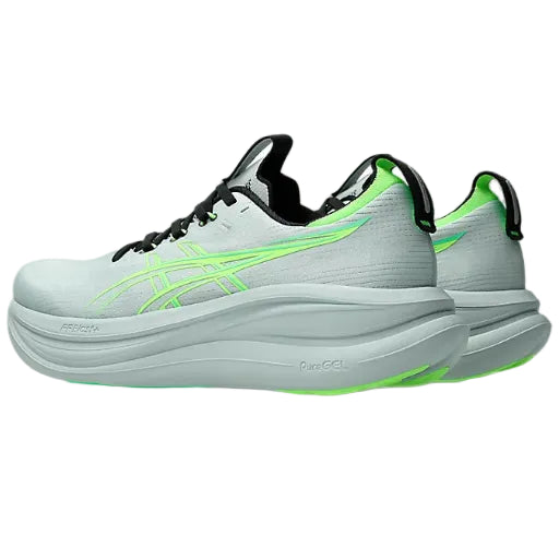 Light blue running shoes with green accents on a white background