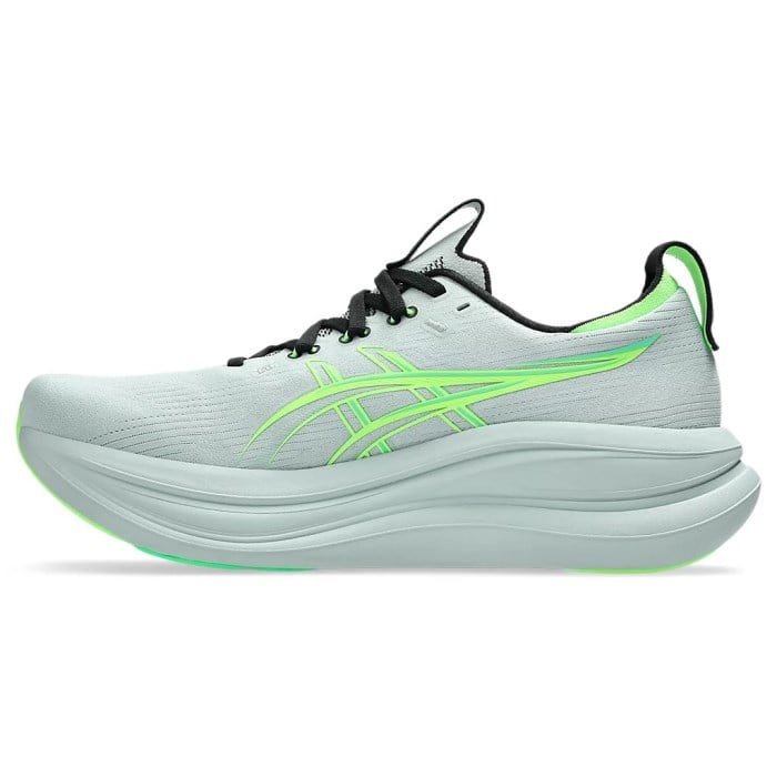 Light gray running shoe with green accents on a white background