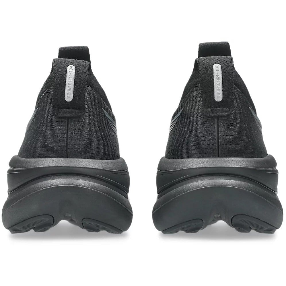 Black slip-on shoes with a brand logo on a white background