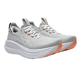 Pair of gray running shoes with white soles on a white background