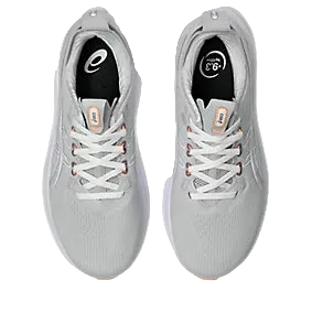 Pair of gray running shoes with white laces on a white background