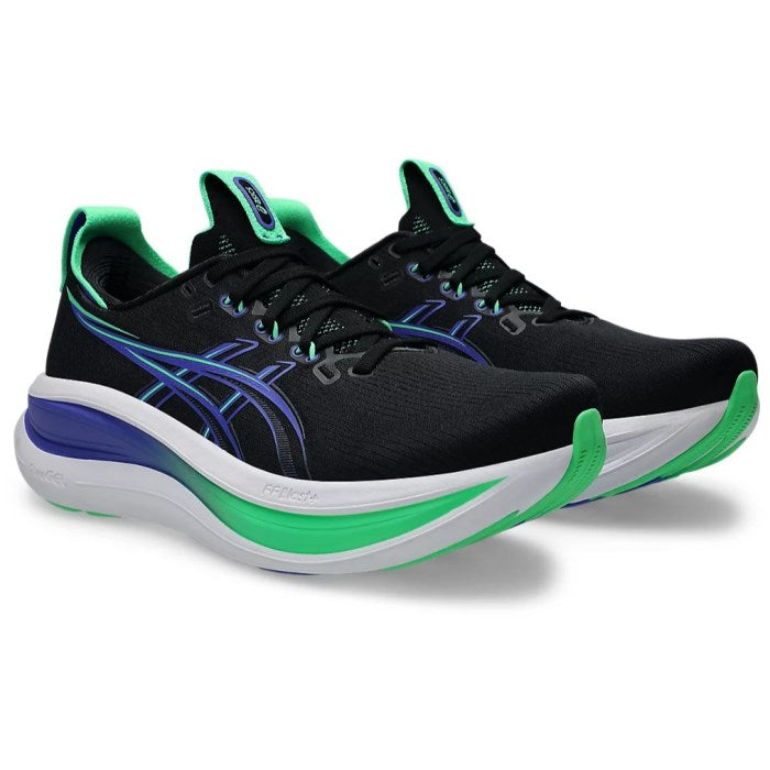Black running shoes with green and blue accents on a white background