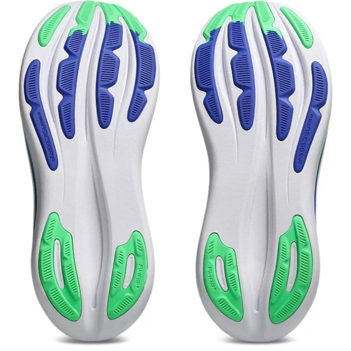 Pair of shoe insoles with green and blue accents on a white background