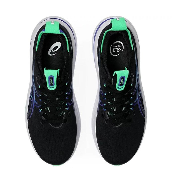 Black running shoes with green accents on a white background