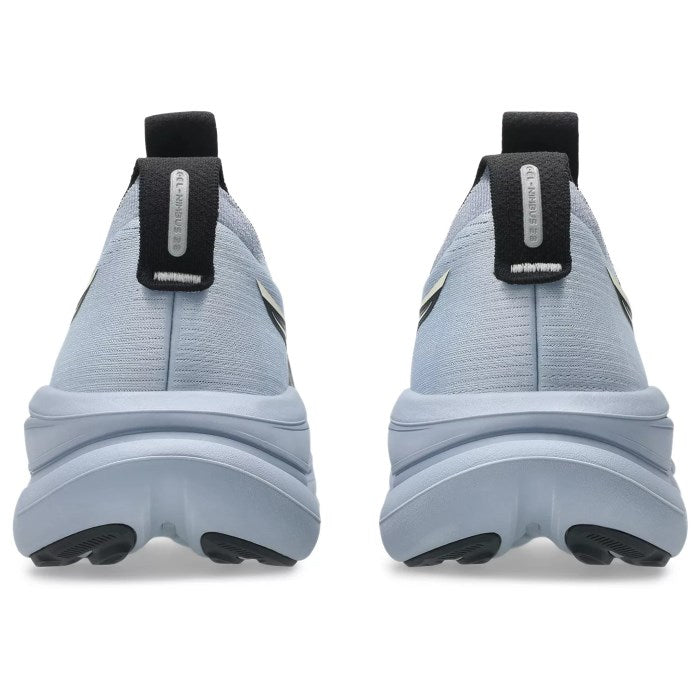 Light blue athletic shoes with black accents on a white background
