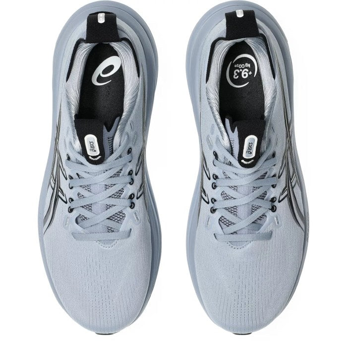 Pair of light gray running shoes with black accents on a white background
