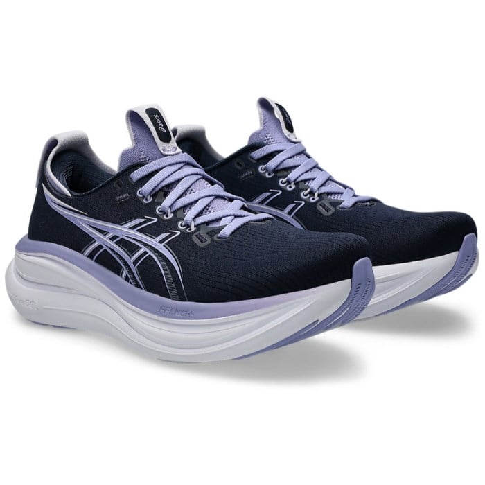 Black and purple running shoes on a white background